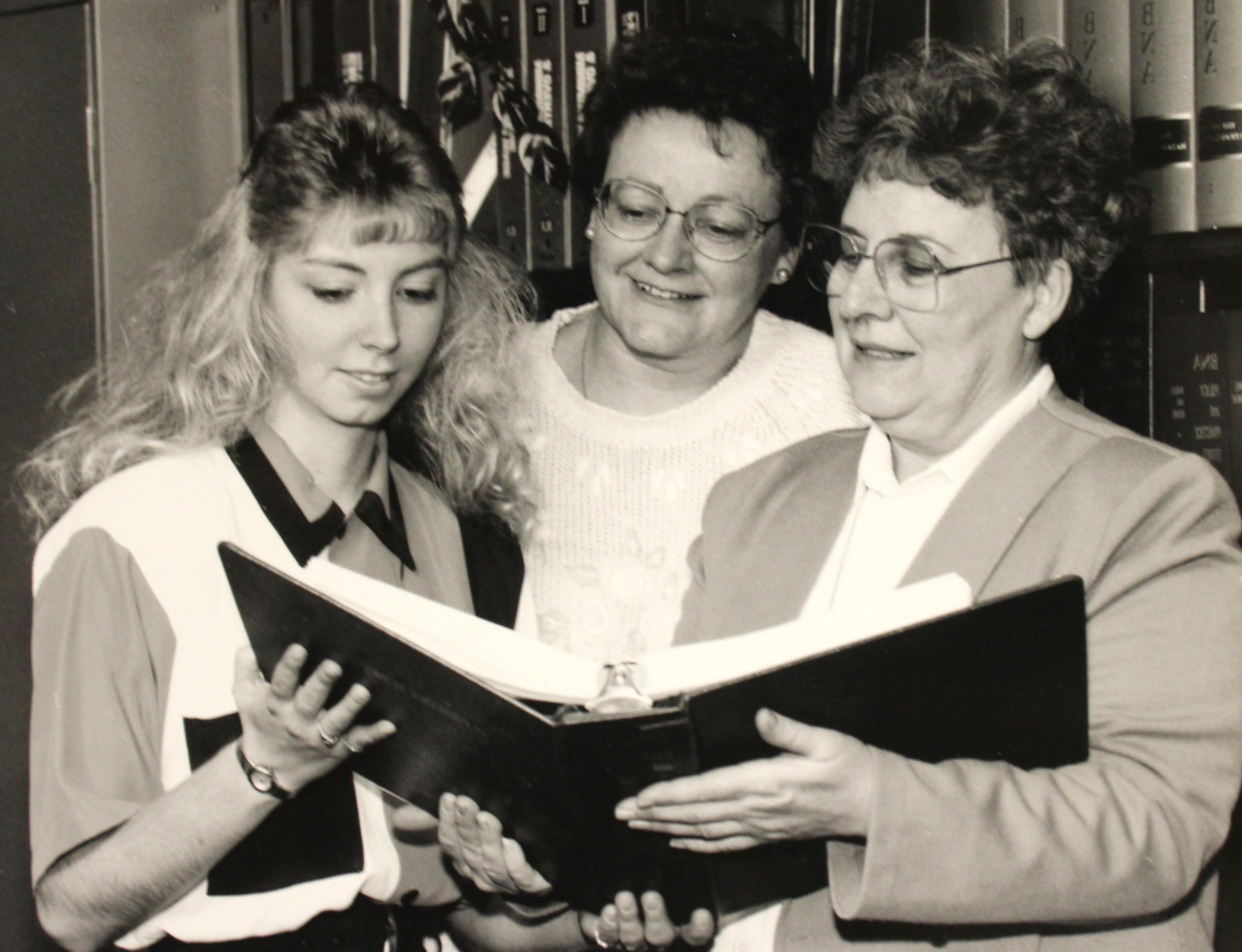 Three employees of the Wadena college, on campus in 1994